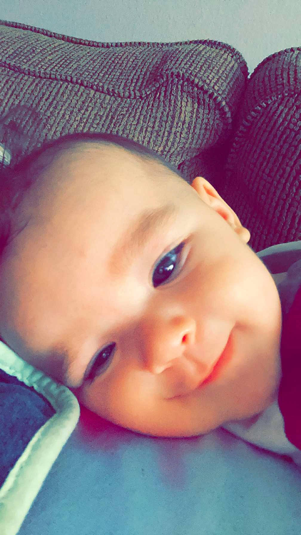 William is registered to the contest to win money with this photo: baby, cap, cheek, chin, cool, eye, eyebrow, eyelash, finger, forehead, happy, headgear, iris, lip, mouth, nose, person, pink, skin, smile