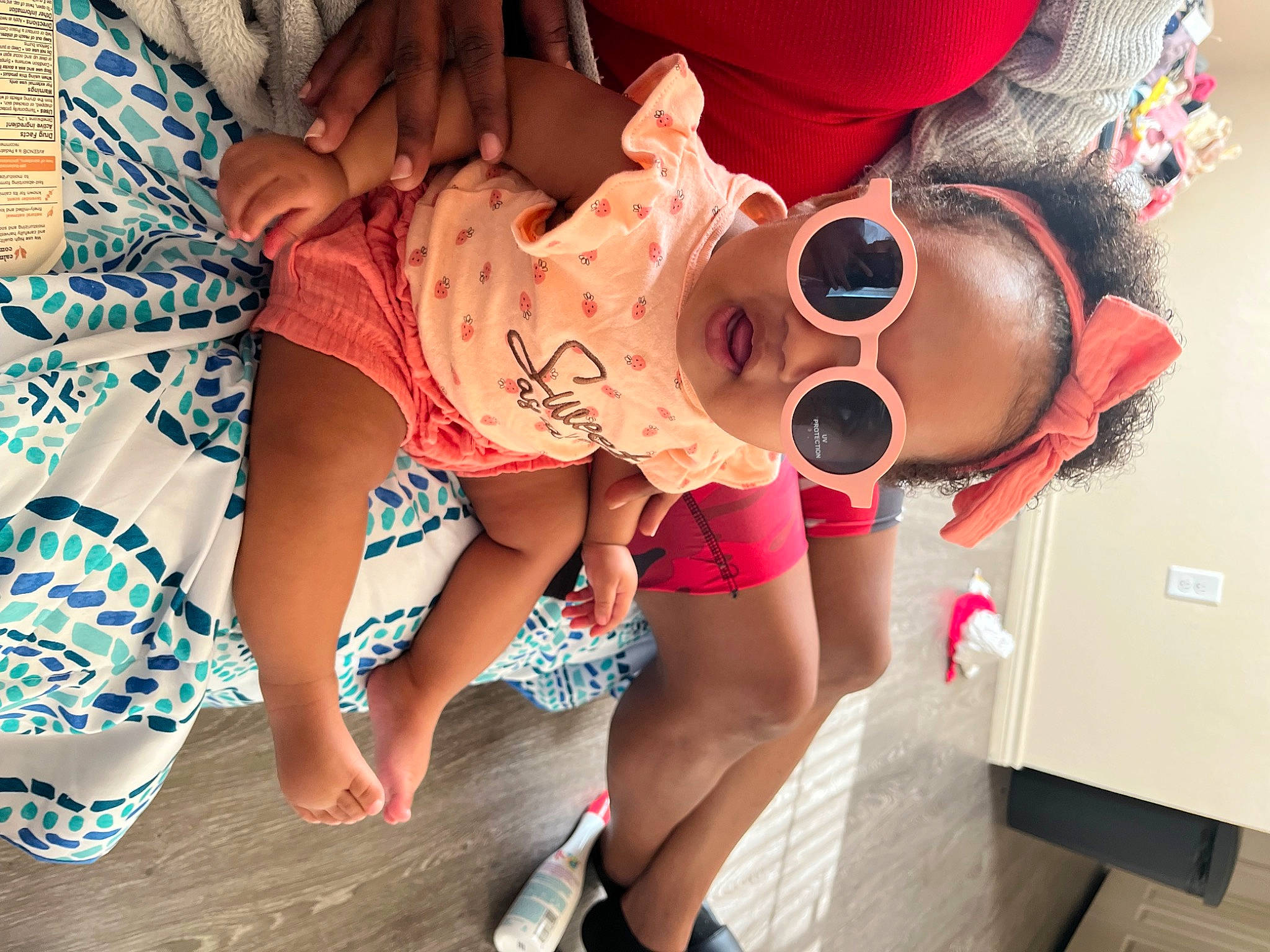 Brooklynn is registered to the contest to win money with this photo: child, elbow, eyewear, fun, glasses, goggles, happy, hat, human_leg, leg, leisure, mouth, person, pink, shoe, shorts, sunglasses, t_shirt, thigh, trunk