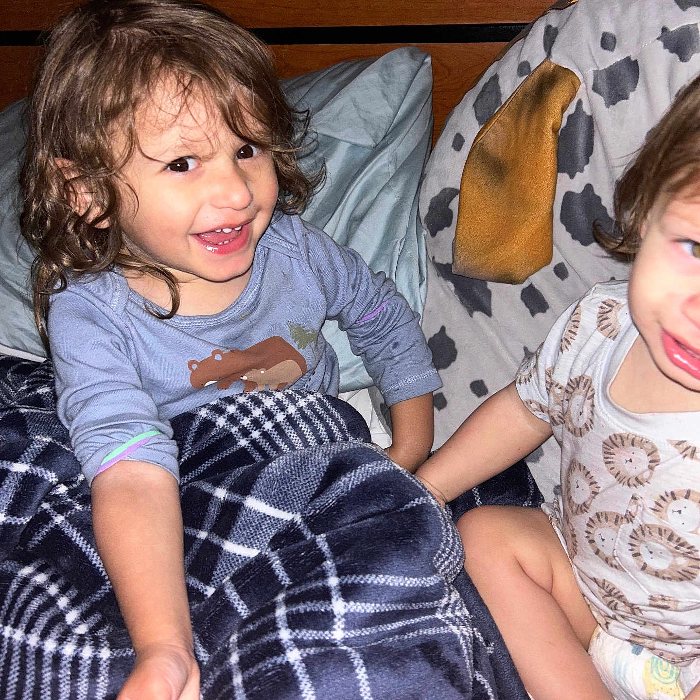 Matthiew joined the competition — help win amazing prizes! animal_print, bed, blanket, candid, child, clothing, cute, diaper, face, hair, happy, holding_hands, indoor, pattern, person, pillow, plaid, smiling, toddler, wood