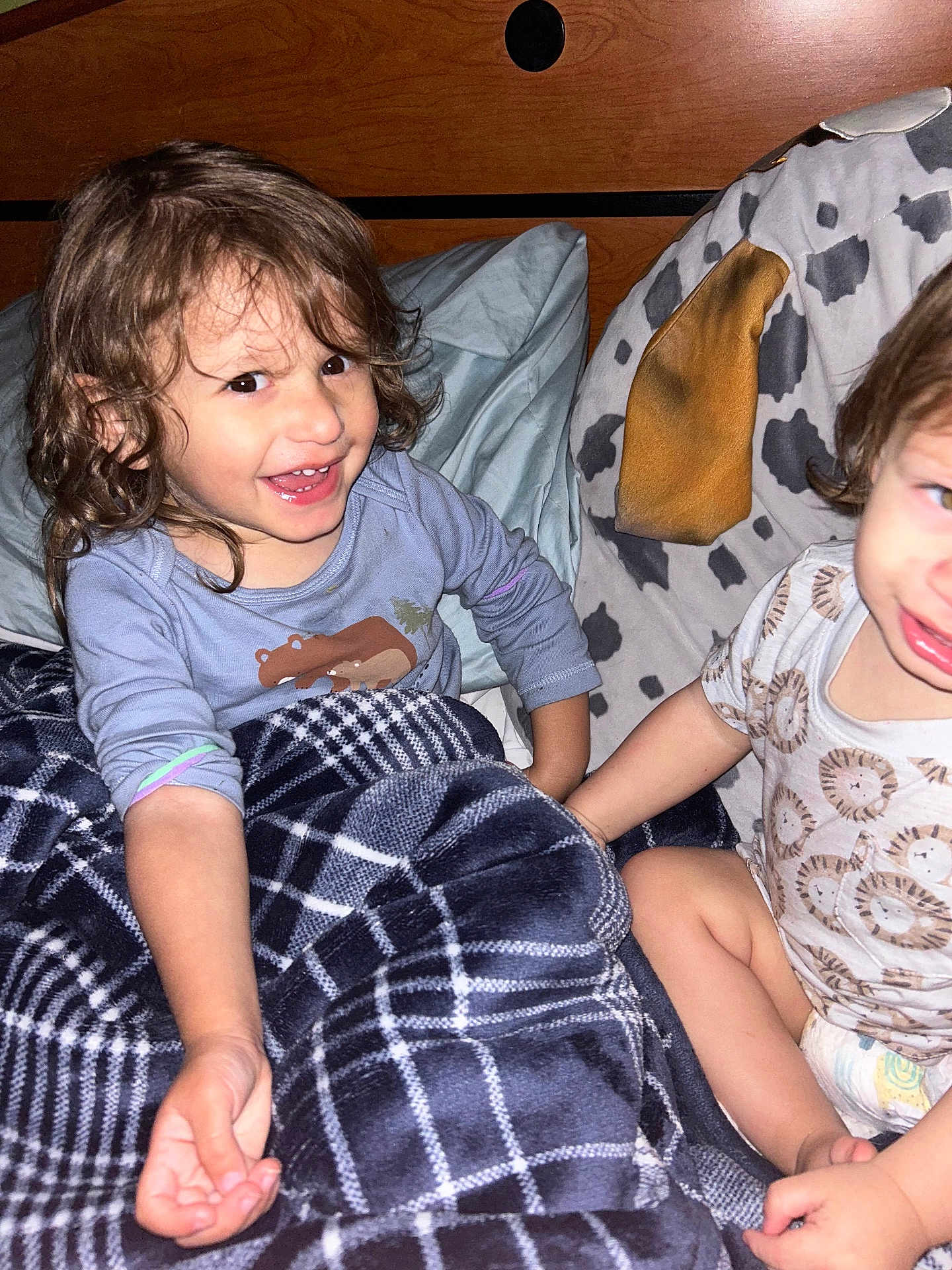 Matthiew joined the competition — help win amazing prizes! child, toddler, blanket, bed, pillow, smiling, clothing, plaid, hair, diaper, indoor, cute, happy, person, face, wood, animal_print, pattern, holding_hands, candid