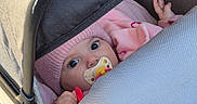 Maya a rejoint le concours — aidez-le/la à gagner de superbes lots ! baby, pacifier, stroller, toy, pink_clothing, hat, hand, infant, child, face, eyes, fabric, seat, outdoor, cute, bundle, warm, expression, portrait, closeup