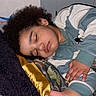 Noah joined the competition — help win amazing prizes! child, sleeping, curly_hair, blanket, bedroom, cozy, pajamas, peaceful, rest, indoor, person, portrait, relaxation, comfort, sleep, skin, hand, face, couch, soft