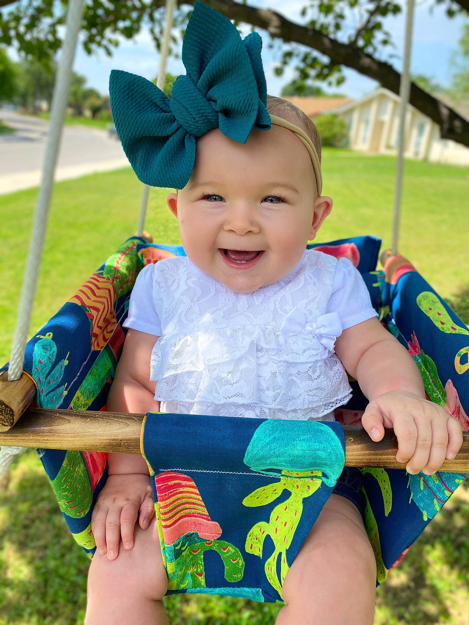 Erin is registered to the contest to win money with this photo: baby, baby_products, baby_toddler_clothing, child, ear, fun, happy, head, headgear, headwear, joy, pattern, person, play, smile, summer, swing, toddler, tree, vacation