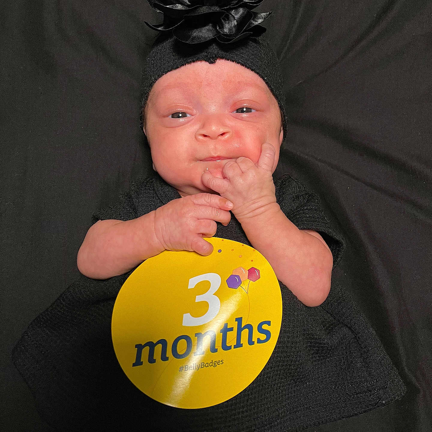 Octavia is registered to the contest to win money with this photo: accessories, baby, badge, balloon, bodypart, cap, clothing, face, finger, hand, hat, head, headband, logo, newborn, person, photography, portrait, symbol, t_shirt