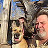 beard, cap, casual, collar, dog, face, fence, hammock, happy, man, outdoor, person, pet, porch, sky, smiling, sunlight, trees, woman, wood