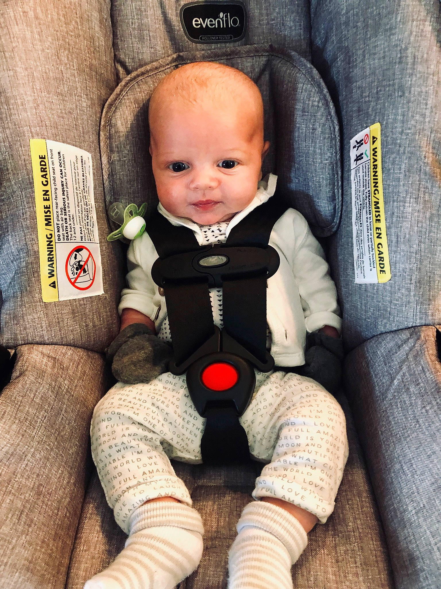 Coen is registered to the contest to win money with this photo: auto_part, baby, baby_carriage, baby_in_car_seat, car_seat, cheek, child, comfort, doll, person, product, seat_belt, sitting, toddler, toy