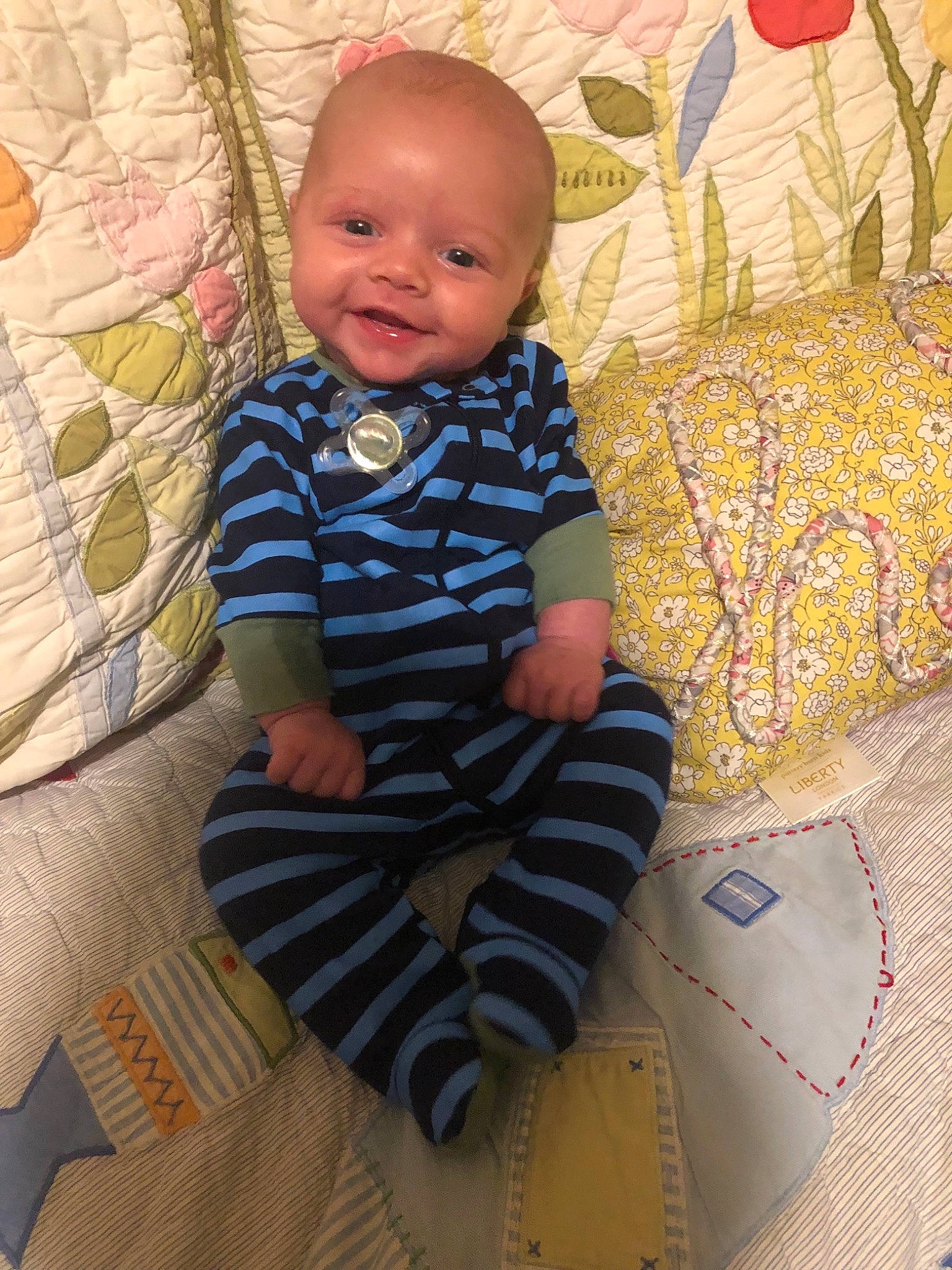 Coen is registered to the contest to win money with this photo: baby, baby_toddler_clothing, child, pattern, person, sitting, skin, textile, toddler