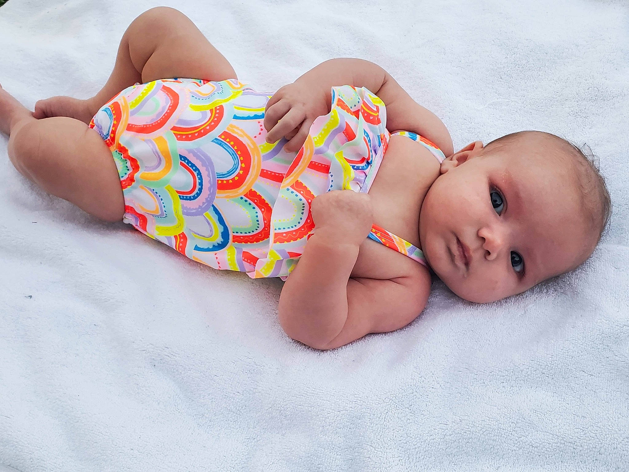 Freya is registered to the contest to win money with this photo: arm, art, baby, baby_sleeping, baby_toddler_clothing, child, comfort, finger, foot, head, headgear, human_body, human_leg, linens, nail, pattern, person, skin, stomach, thigh