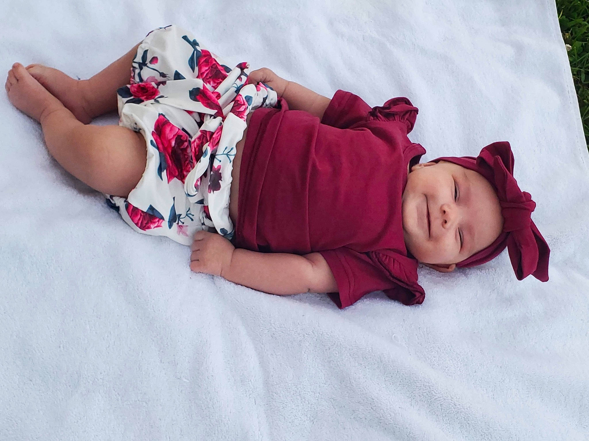 Freya is registered to the contest to win money with this photo: baby, baby_toddler_clothing, child, comfort, fun, happy, headwear, human_body, human_leg, joy, knee, leg, linens, magenta, pattern, person, pink, plant, purple, skin