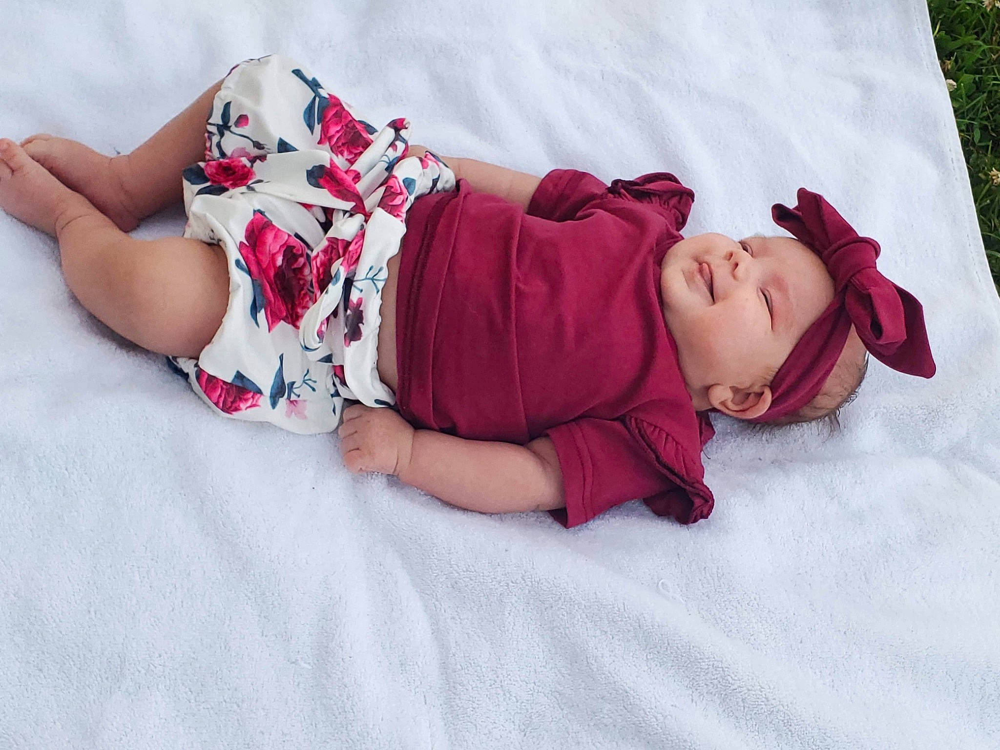 Freya is registered to the contest to win money with this photo: baby_toddler_clothing, comfort, eye, hand, head, headwear, human_body, human_leg, joint, knee, leg, leisure, linens, magenta, pattern, person, pink, purple, skin, sleeve
