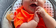 Tyde joined the competition — help win amazing prizes! baby, baby_seat, child, clothing, cushion, cute, floor, hand_clapping, happy, indoor, infant, orange_shirt, pacifier, person, playful, portrait, red_shorts, smiling, toy, young_child