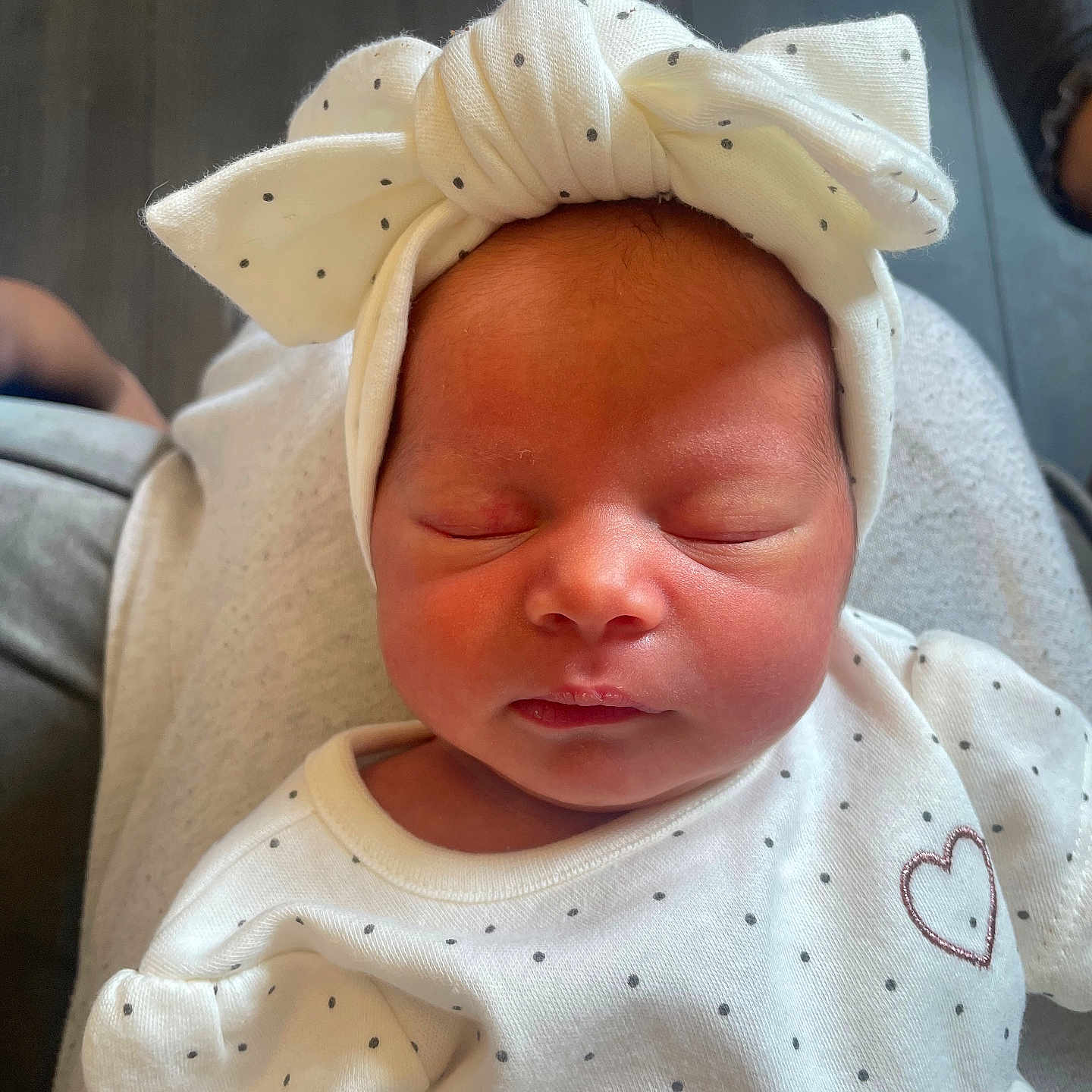 Kaira-Marcia is registered to the contest to win money with this photo: baby, calm, child, close_up, cute, face, head, headband, human, indoor, infant, newborn, peaceful, person, polka_dots, portrait, sleeping, soft_lighting, toddler, white_clothing