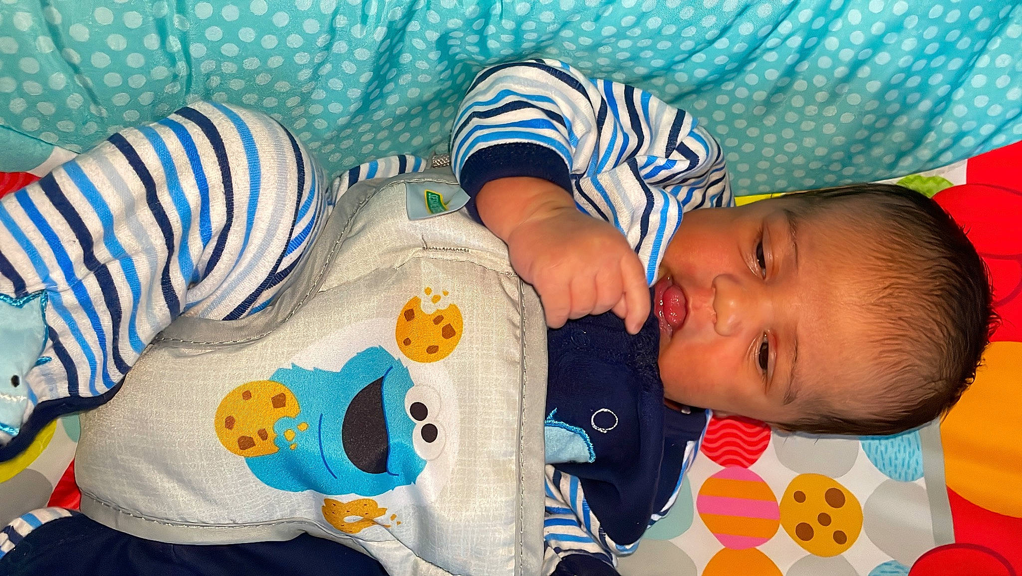 Jalen is registered to the contest to win money with this photo: arm, azure, baby, baby_products, baby_sleeping, baby_toddler_clothing, cheek, child, comfort, happy, linens, mammal, nose, pattern, people, person, product, skin, sleeve, textile