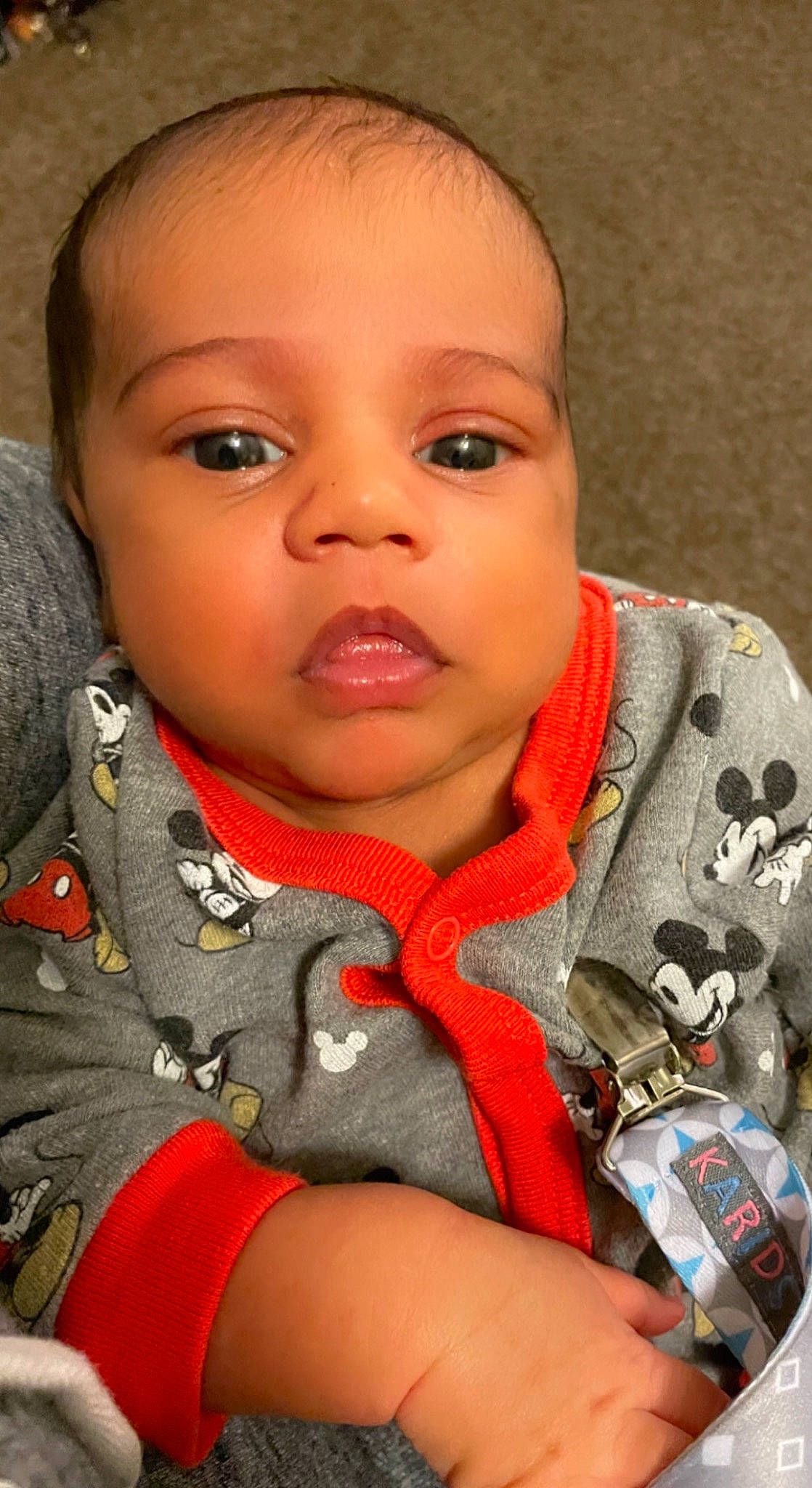 Jalen is registered to the contest to win money with this photo: baby, cheek, child, chin, eyebrow, eyelash, facial_expression, finger, gesture, hairstyle, iris, lip, mouth, nail, neck, nose, person, personal_protective_equipment, skin, sleeve
