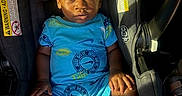 Christopher joined the competition — help win amazing prizes! baby, blond_hair, blue_clothing, car_interior, car_seat, casual_wear, child, daylight, footwear, infant, interior, portrait, safety, seatbelt, serious_expression, sitting, sneakers, sunlight, toddler, young_child