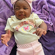Miorine joined the competition — help win amazing prizes! baby, infant, pink_bow, purple_blanket, cute, playful_expression, clothing, onesie, smiling, portrait, child, soft_texture, lying_down, hand, headwear, indoors, cozy, happy, person, toddler