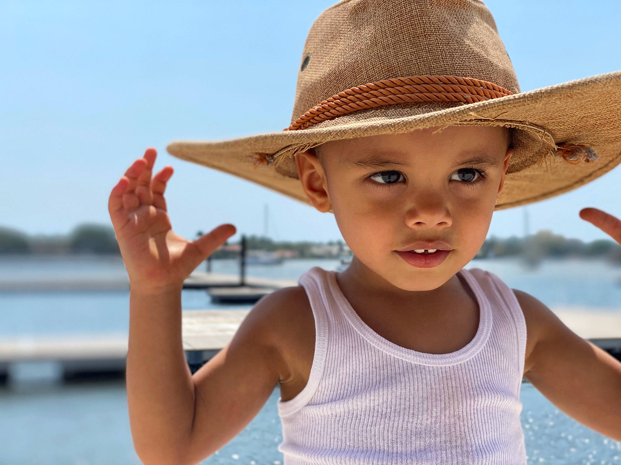 Atlas is registered to the contest to win money with this photo: child, clothing, cowboy_hat, fashion_accessory, fun, hat, headgear, headwear, leisure, person, play, smile, summer, sun_hat, toddler, travel, vacation