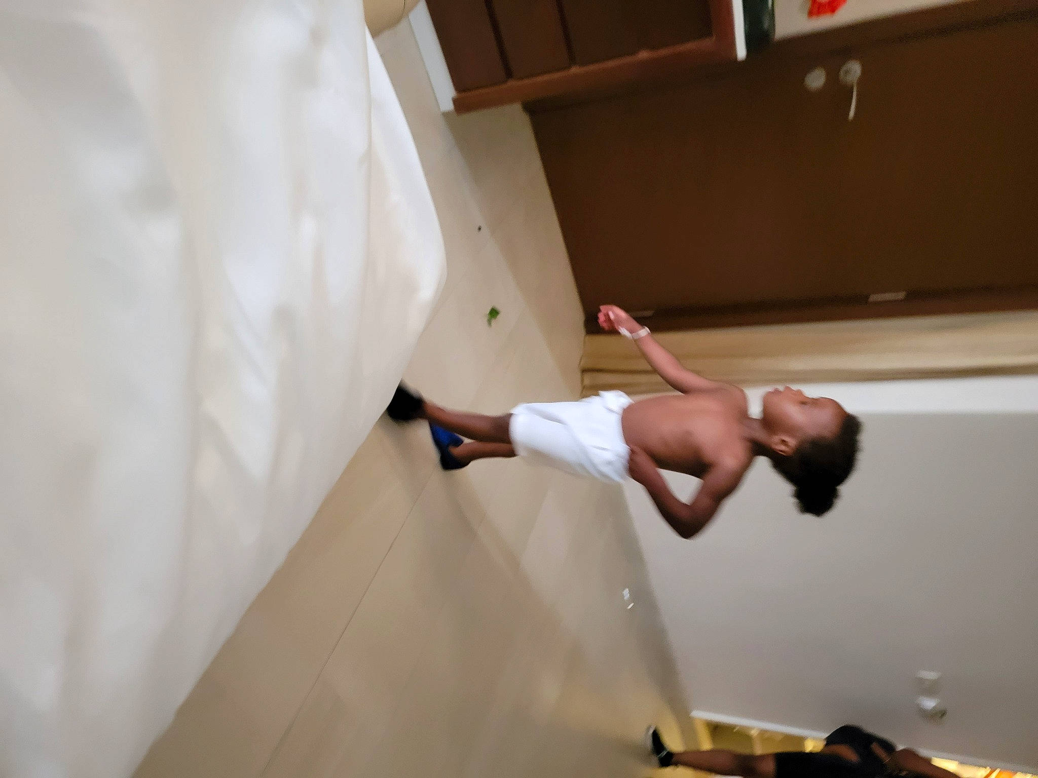 Kendall is registered to the contest to win money with this photo: arm, automotive_design, bridal_clothing, comfort, dress, elbow, event, fashion_design, finger, floor, flooring, gesture, hardwood, human_leg, leg, person, shelf, shoulder, waist, wedding_dress