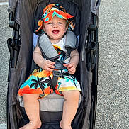 Kylo is registered to the contest to win money with this photo: baby, casual, child, colorful_clothing, daylight, feet, happy, hat, infant, outdoor, park, person, playful, seatbelt, smile, stroller, summer, sunhat, toddler, transport