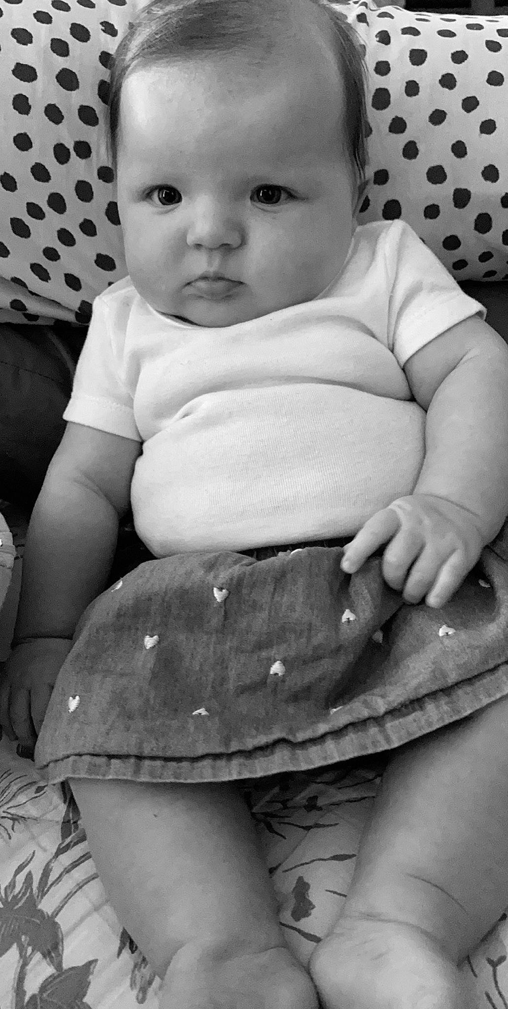 Cienna is registered to the contest to win money with this photo: abdomen, baby, black, black_and_white, cheek, child, eye, monochrome, monochrome_photography, person, photography, sitting, skin, smile, style, toddler, trunk