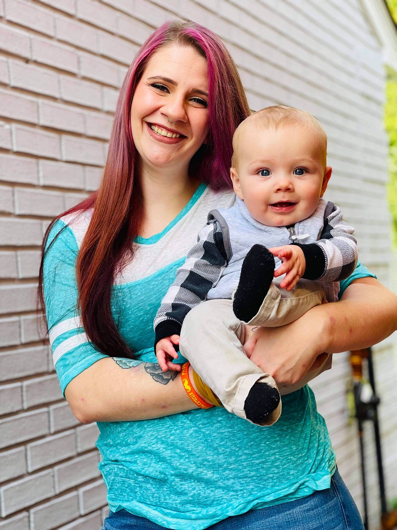 Daniel is registered to the contest to win money with this photo: baby, baby_toddler_clothing, event, eye, face, fun, gesture, happy, head, interaction, joy, leisure, muscle, person, pink, shoulder, skin, sleeve, smile, street_fashion