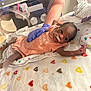 Riley joined the competition — help win amazing prizes! newborn, baby, incubator, hospital, medical, gloved_hand, onesie, blanket, heart_pattern, infant, healthcare, person, lying_down, tubes, monitoring, patient, care, small, cute, fragile