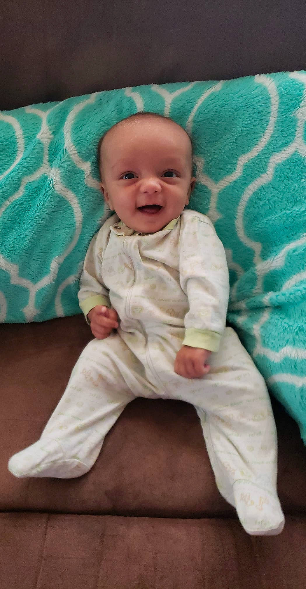 Kiernan is registered to the contest to win money with this photo: baby, baby_toddler_clothing, child, head, person, sitting, skin, smile, toddler