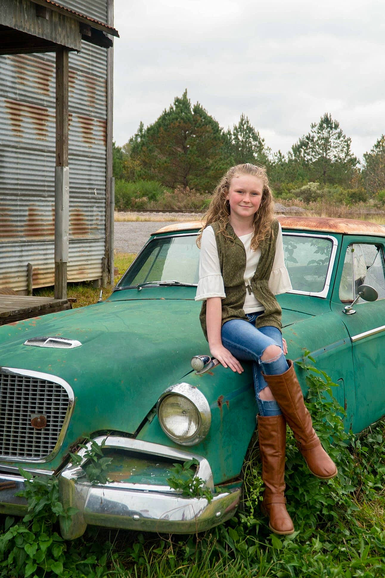 Regan joined the competition — help win amazing prizes! antique_car, car, classic, classic_car, coupe, full_size_car, grass, joy, land_vehicle, motor_vehicle, person, sedan, vehicle, vehicle_door, vintage_car