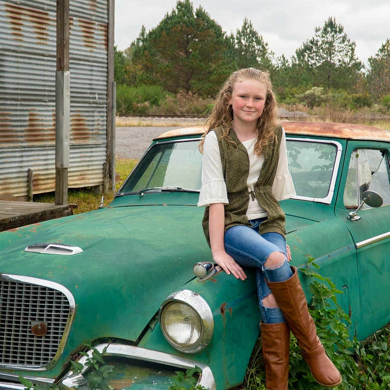 Regan joined the competition — help win amazing prizes! antique_car, car, classic, classic_car, coupe, full_size_car, grass, joy, land_vehicle, motor_vehicle, person, sedan, vehicle, vehicle_door, vintage_car