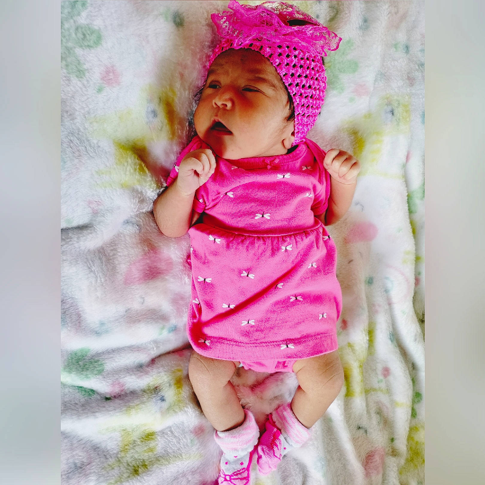 Rosanette is registered to the contest to win money with this photo: baby, baby_toddler_clothing, cap, cheek, child, collar, dress, eye, face, hat, headwear, linens, magenta, pattern, person, pink, purple, skin, sleeve, toddler