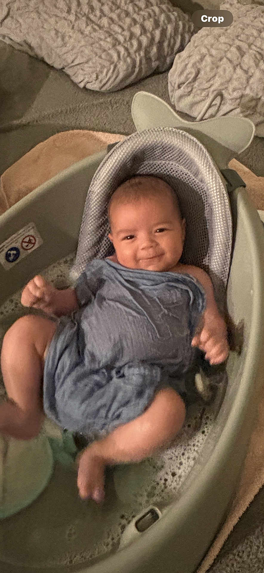 Taio is registered to the contest to win money with this photo: baby, smiling, bath, bathtub, water, bubbles, cloth, infant, headrest, happy, skin, person, child, indoors, toddler, relaxation, cleaning, seat, comfort, playful