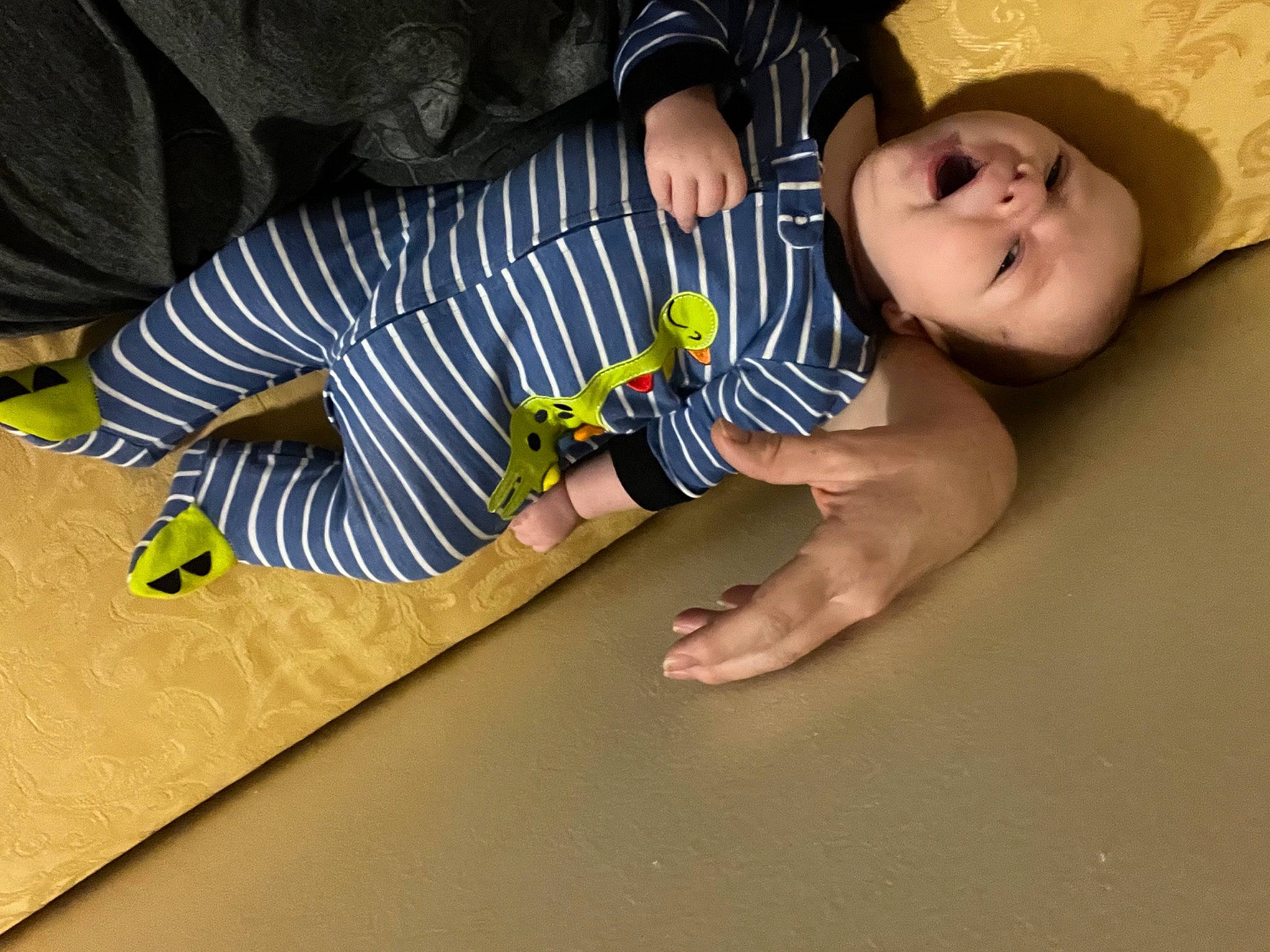 Kolton is registered to the contest to win money with this photo: baby, baby_toddler_clothing, child, comfort, elbow, finger, flash_photography, floor, flooring, foot, fun, gesture, happy, human_leg, person, sitting, smile, thigh, toddler, wood