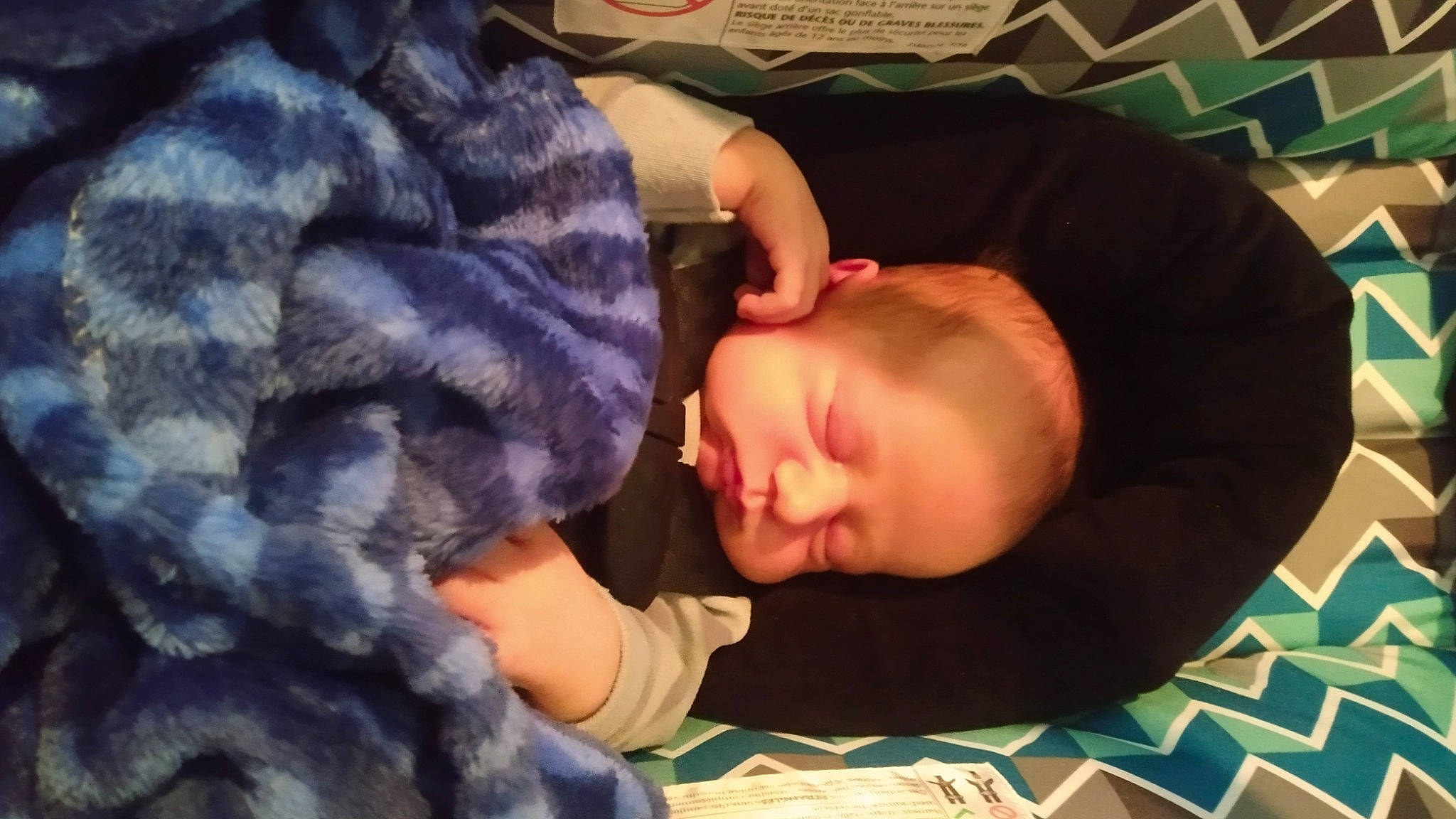 Ryder is registered to the contest to win money with this photo: baby, baby_toddler_clothing, bedtime, cheek, child, comfort, flooring, fun, fur, mouth, nap, nose, pattern, person, play, room, sitting, sleep, t_shirt, thumb