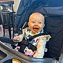 Solaris is registered to the contest to win money with this photo: baby, bib, cafe, chair, child, clothing, cute, daylight, food, happy, head, indoor, infant, messy_face, person, seatbelt, smile, stroller, table, window