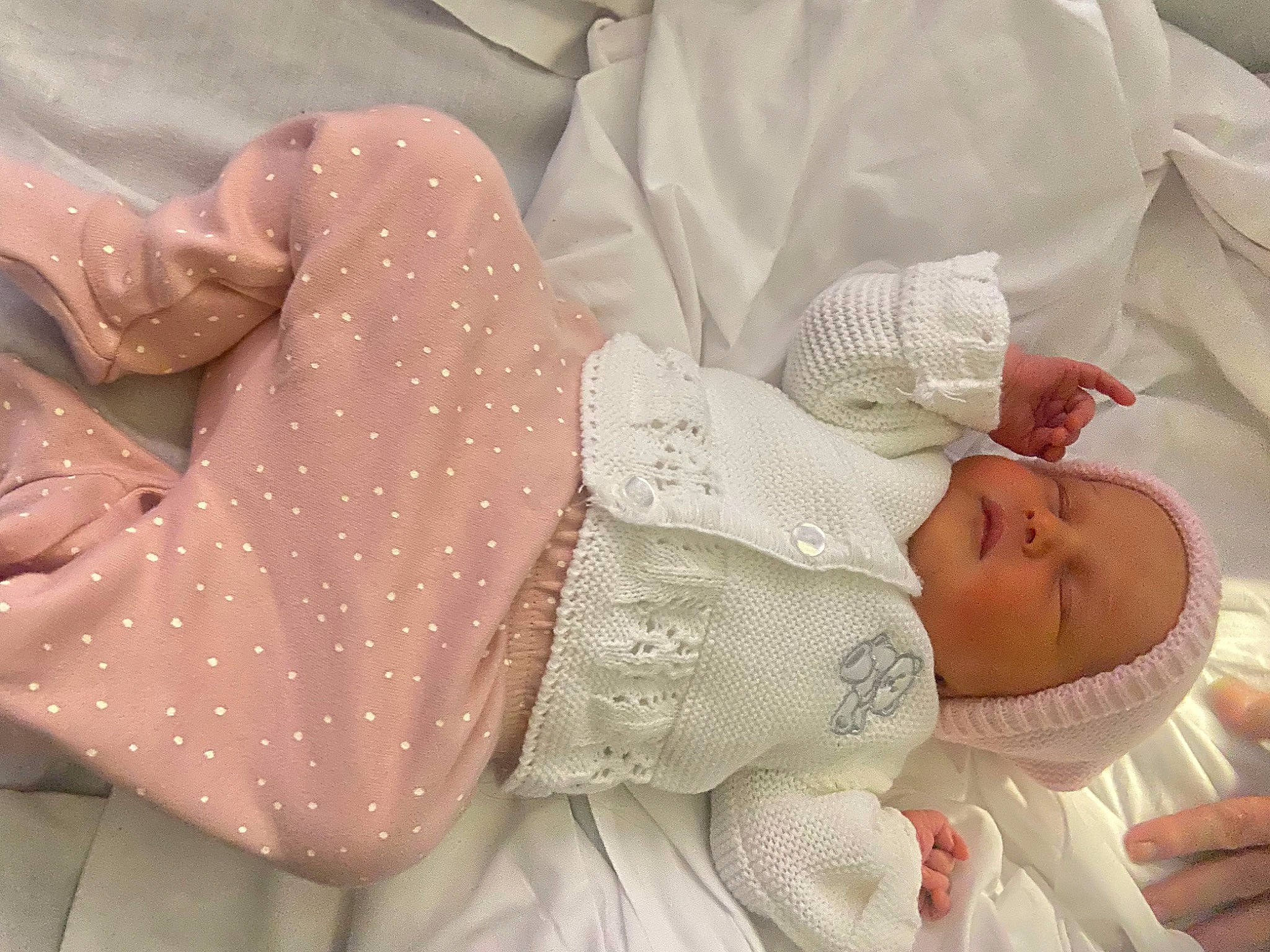 Kayleigh is registered to the contest to win money with this photo: arm, baby, baby_products, baby_toddler_clothing, child, comfort, fashion_accessory, hand, happy, head, linens, pattern, peach, person, pink, product, room, skin, sleeve, textile