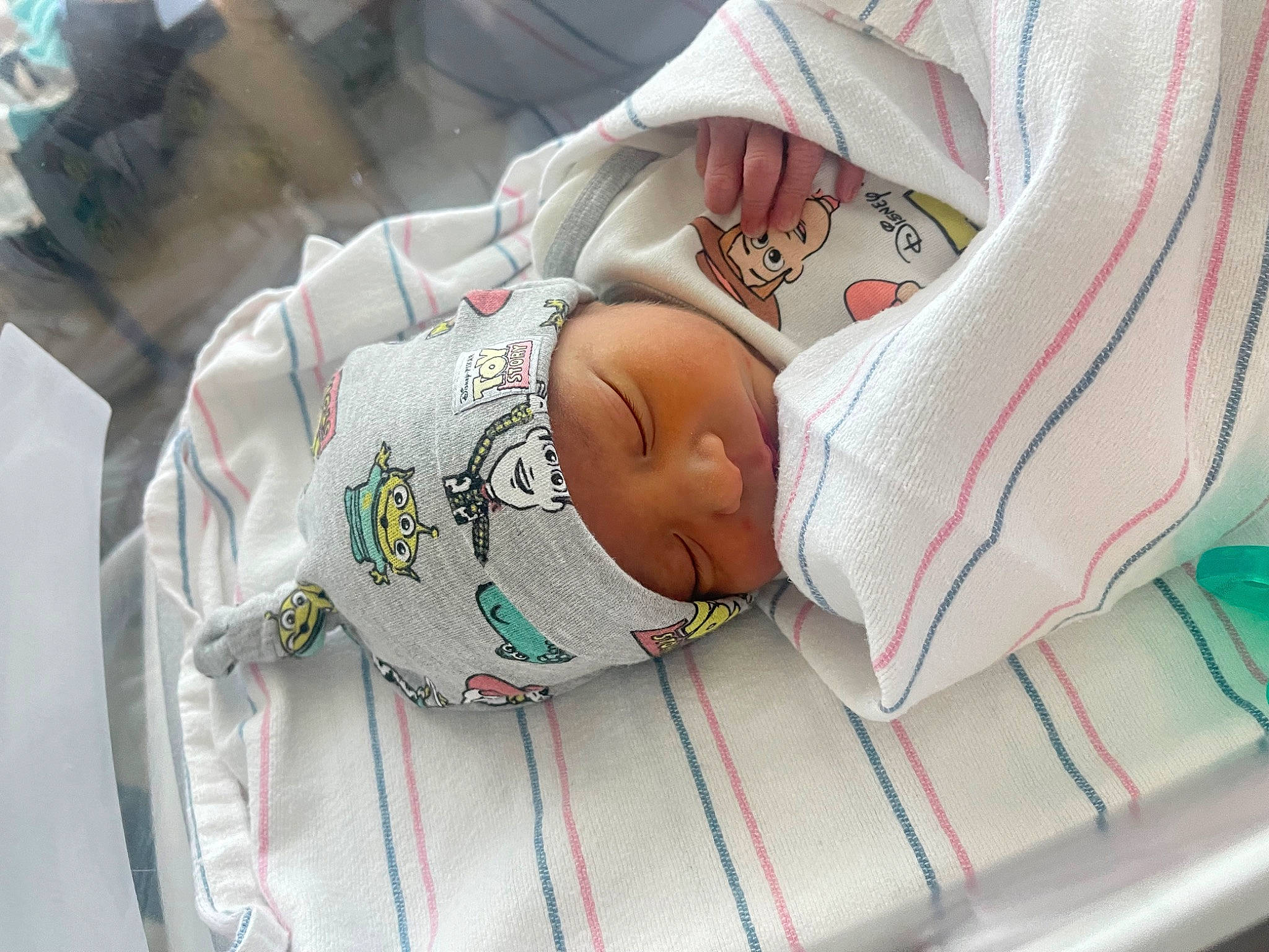 Adrian is registered to the contest to win money with this photo: baby, baby_products, baby_safety, baby_sleeping, baby_toddler_clothing, carmine, child, comfort, head, headwear, linens, person, room, toddler