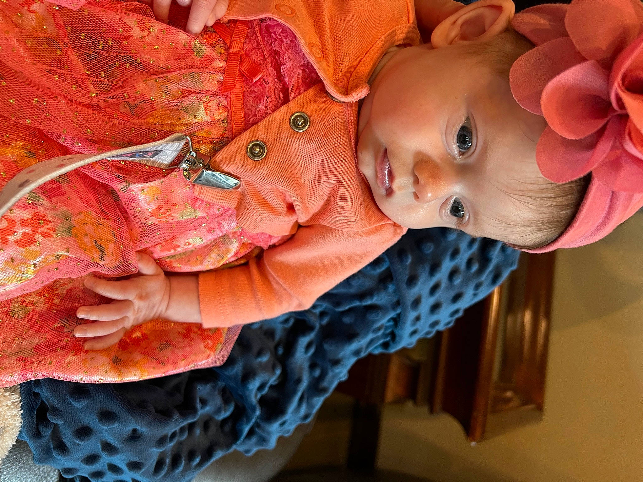 Bristol is registered to the contest to win money with this photo: art, baby, baby_products, baby_toddler_clothing, child, doll, eye, fashion_accessory, headwear, human_body, iris, orange, pattern, peach, person, pink, plant, red, skin, textile