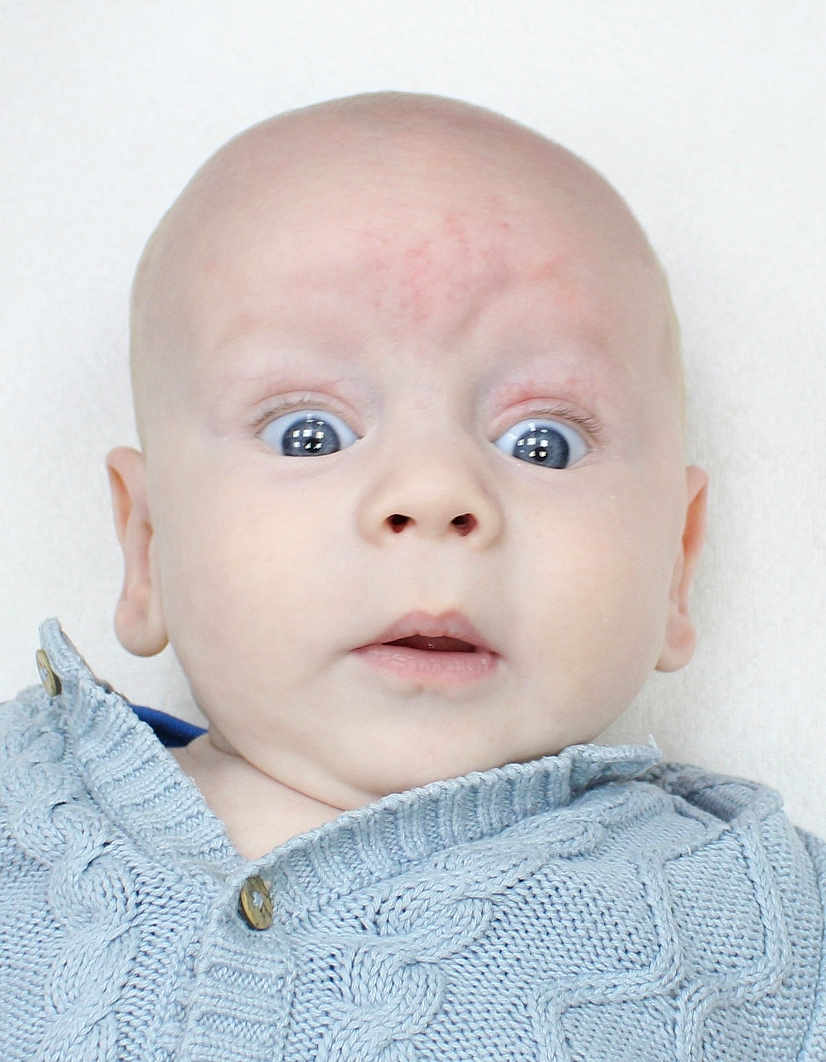 Wesley joined the competition — help win amazing prizes! baby, child, face, wide_eyes, knitted_sweater, blue_sweater, infant, portrait, cute, expression, surprised, curious, head, skin, closeup, young, indoors, soft_light, clothing, person