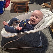 Wesley joined the competition — help win amazing prizes! baby, infant, smiling, baby_rocker, cushion, carpet, chair, footwear, slippers, clothing, indoor, person, happy, relaxing, home, furniture, baby_garment, head, face, small_child