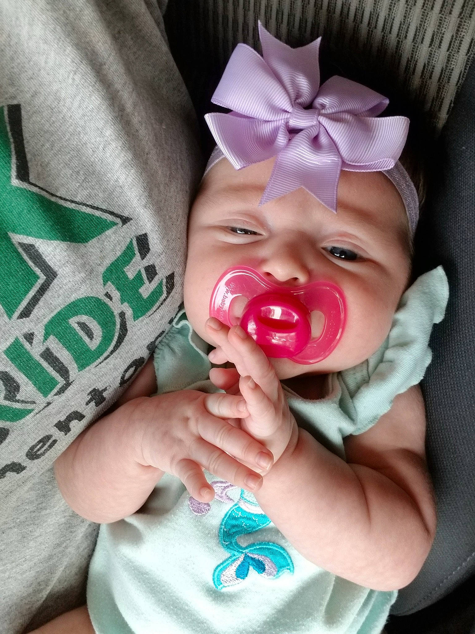 Kassidy is registered to the contest to win money with this photo: baby, child, facial_expression, finger, hand, mouth, nose, person, pink, smile, toddler