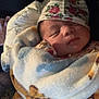 Rosalina is registered to the contest to win money with this photo: baby, newborn, sleeping, blanket, hat, floral, cozy, infant, wrapped, cute, child, soft, warm, resting, portrait, indoors, peaceful, face, headwear, comfort