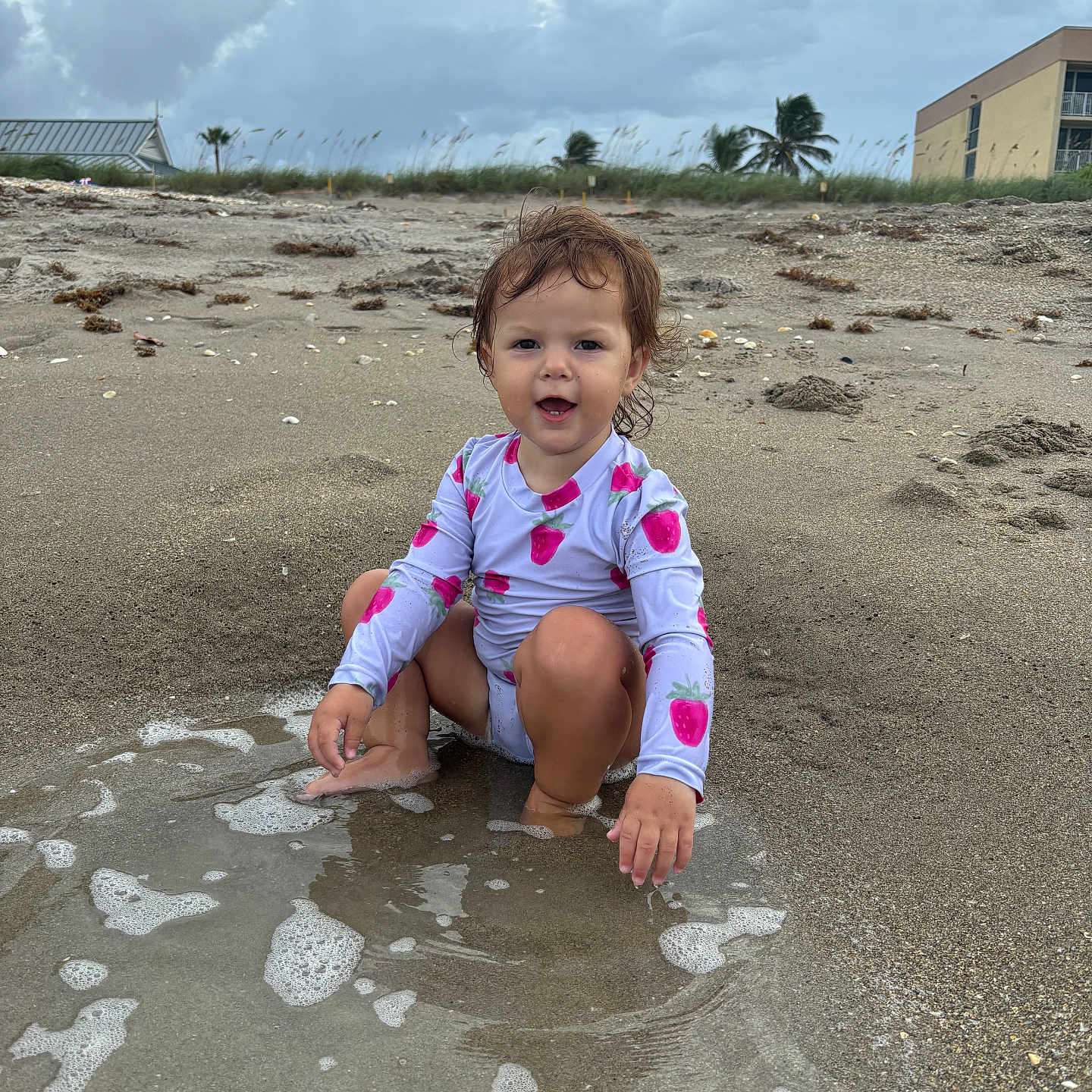 Hazel is registered to the contest to win money with this photo: beach, bodypart, child, coast, face, female, finger, girl, hand, head, nature, outdoors, person, photography, portrait, sea, shoreline, sitting, soil, water
