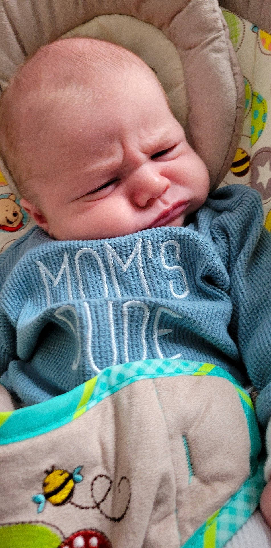 Camden is registered to the contest to win money with this photo: baby, baby_toddler_clothing, cheek, child, chin, close_up, comfort, facial_expression, grass, green, happy, iris, linens, mouth, nose, pattern, person, skin, sleeve, textile