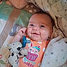 Timburlee joined the competition — help win amazing prizes! baby, bed, blanket, child, cow_toy, cozy, face, happy, indoors, infant, lying_down, nursery, onesie, orange_clothing, pacifier, polka_dots, portrait, smiling, stuffed_animal, toy