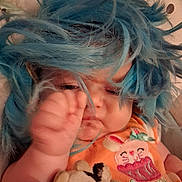 Timburlee is registered to the contest to win money with this photo: baby, birthday, blue_hair, cake_design, child, close_up, costume, cozy, face, funny, indoors, infant, lying_down, orange_outfit, playful, portrait, puppy_toy, sleepy, stuffed_animal, wig