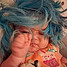 baby, birthday, blue_hair, cake_design, child, close_up, costume, cozy, face, funny, indoors, infant, lying_down, orange_outfit, playful, portrait, puppy_toy, sleepy, stuffed_animal, wig