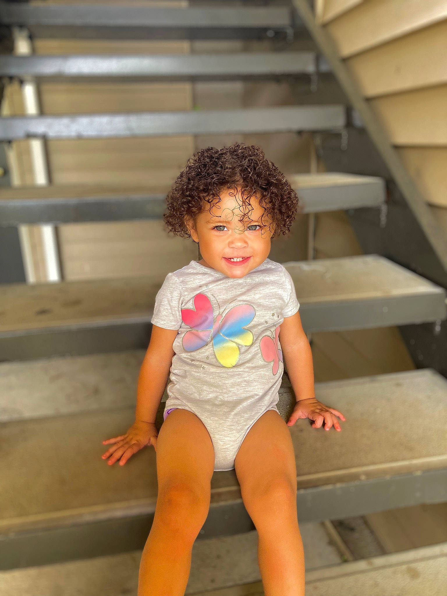 Zarra is registered to the contest to win money with this photo: arm, eye, facial_expression, flash_photography, fun, happy, head, human_body, human_leg, knee, leg, leisure, person, sitting, skin, smile, thigh, toddler, trunk, waist