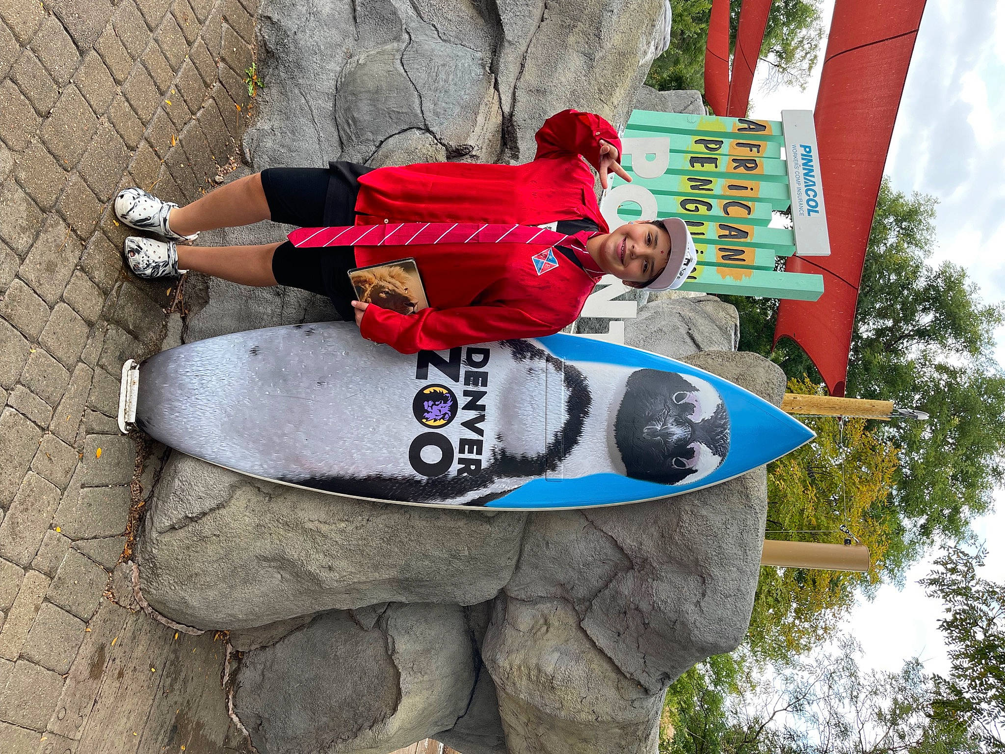 Isabelle joined the competition — help win amazing prizes! carmine, concrete, fun, headwear, human_leg, joy, leisure, person, recreation, sky, sportswear, t_shirt, thigh, tree, walking_shoe