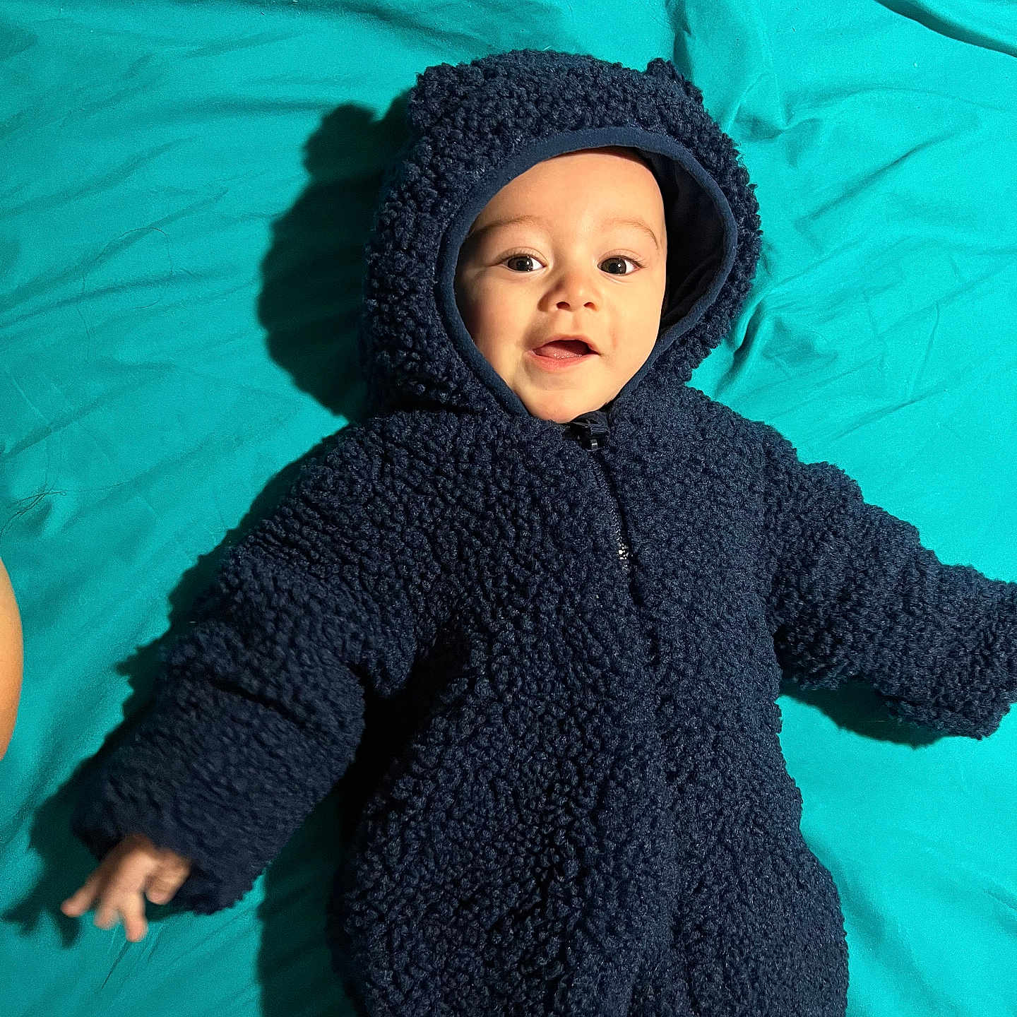 Liam joined the competition — help win amazing prizes! baby, bodypart, bonnet, cap, clothing, coat, face, finger, happy, hat, head, hood, hoodie, knitwear, person, photography, portrait, smile, sweater, sweatshirt