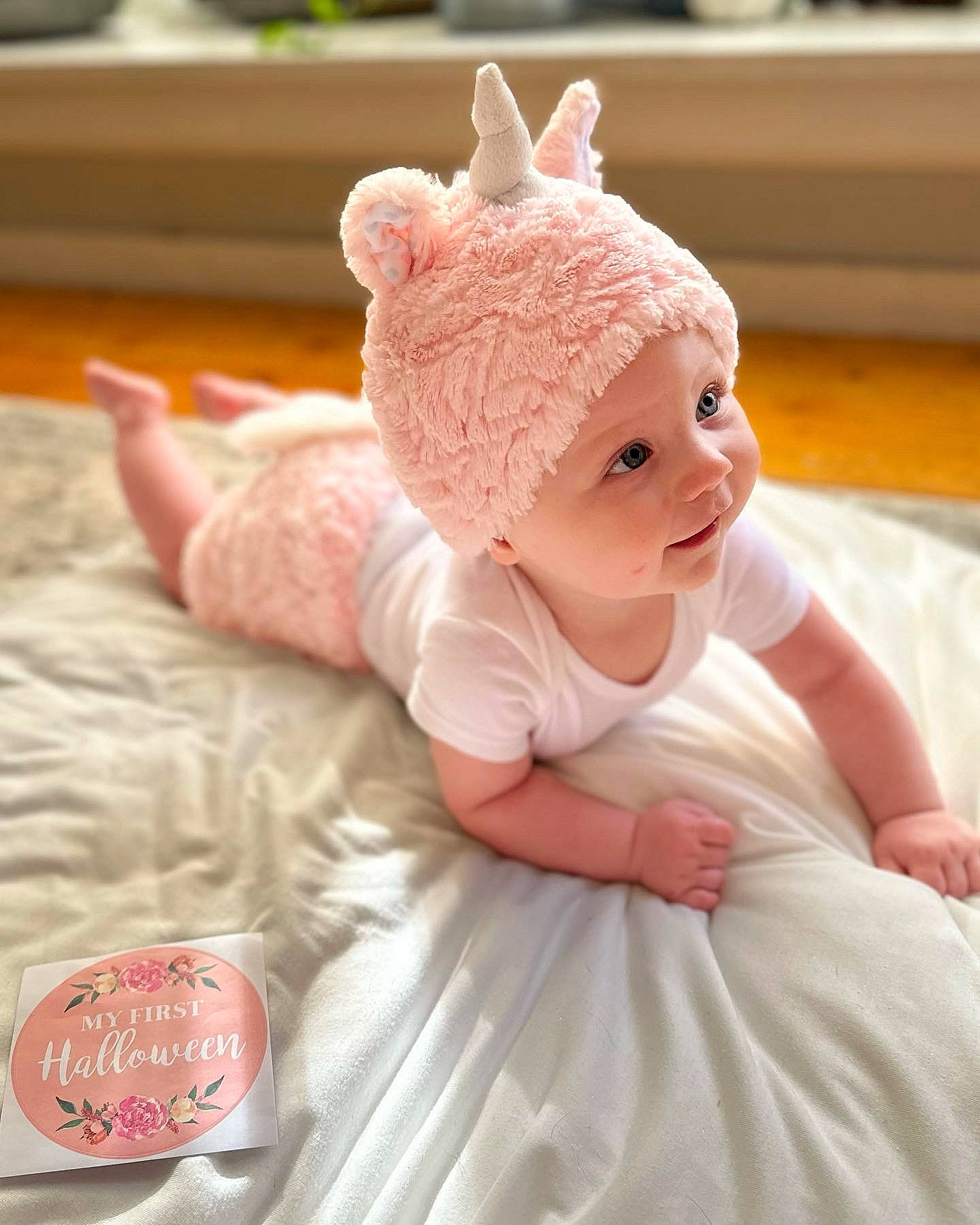 Kora joined the competition — help win amazing prizes! baby, baby_toddler_clothing, cap, child, event, fashion_accessory, fun, hair_accessory, happy, headband, headgear, headpiece, headwear, linens, magenta, peach, person, pink, skin, smile